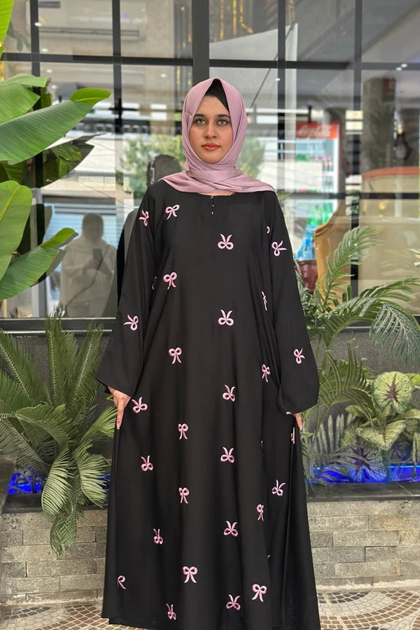 *Women bow abaya